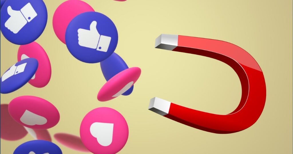 Ímã vermelho atraindo ícones de curtida e de coração das redes sociais